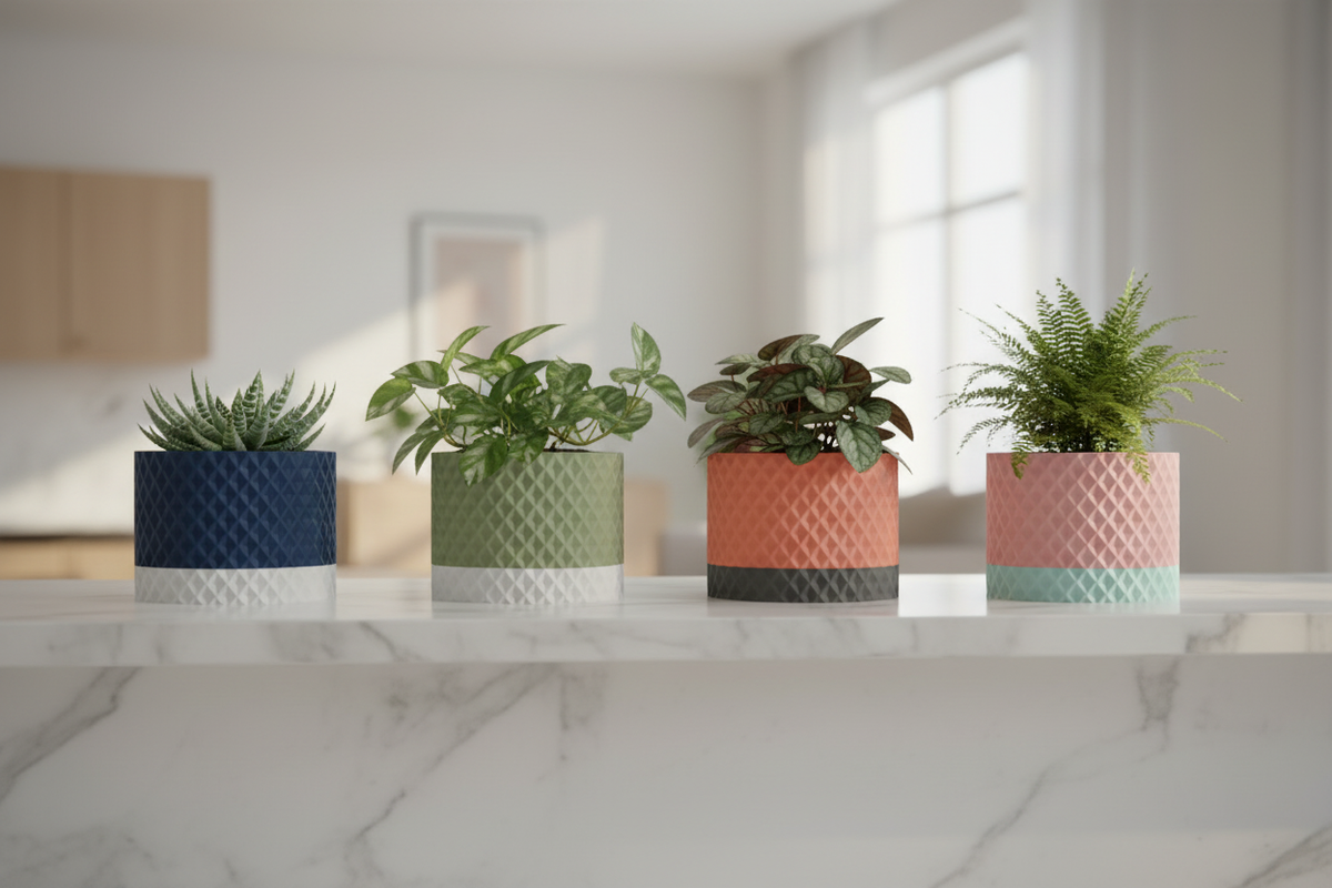 Four Modern Geometric Planters two-tone diamond lattice texture navy white sage beige terracotta grey pink mint compact houseplants succulent pothos peperomia fern pale marble kitchen shelf soft diffuse natural light wide editorial landscape