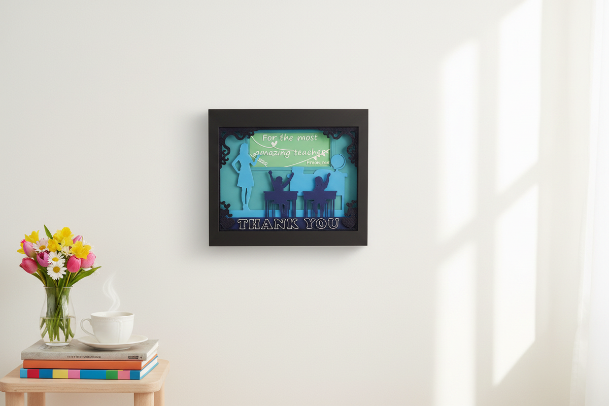 Teacher Appreciation Shadow Box on a white wall in a cosy home with fresh flowers and a cup of tea