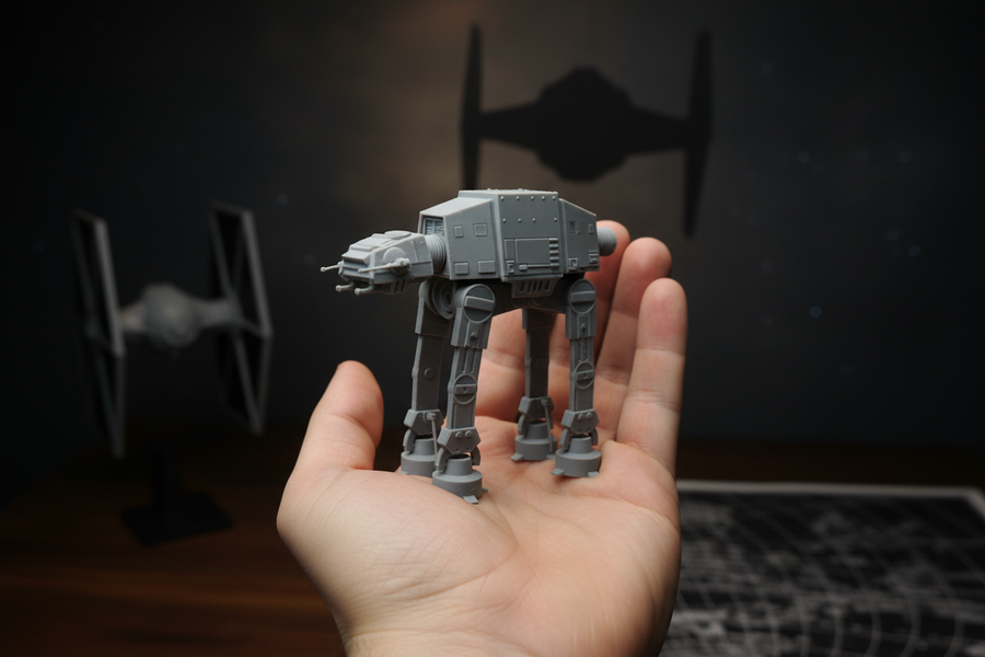 Star Wars AT-AT Springie held in a hand to show palm-sized scale