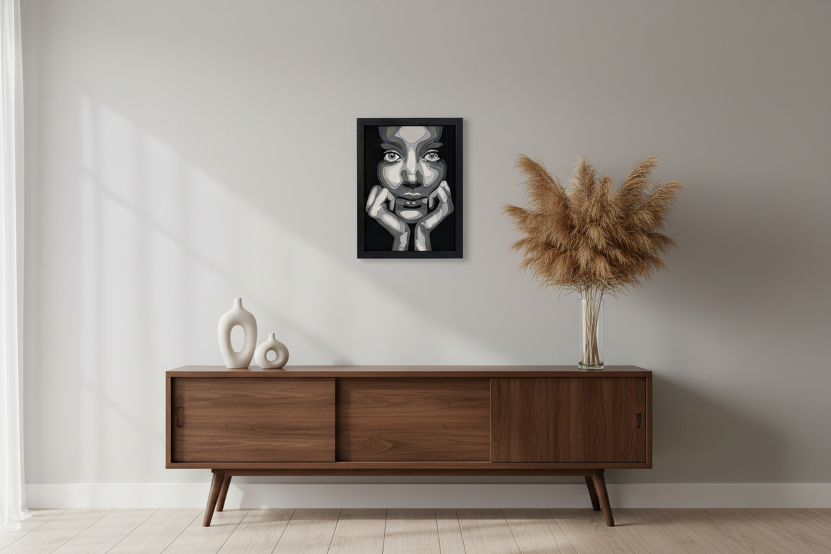 The Girl in Layers Shadow Box hung above a mid-century sideboard with pampas grass