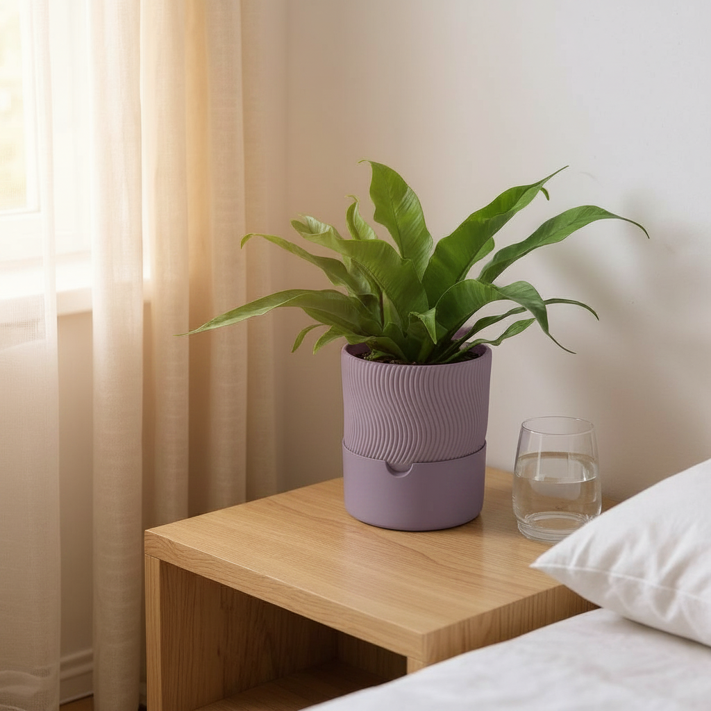 Dusty purple ribbed self-watering planter with peace lily on a wooden bedside table
