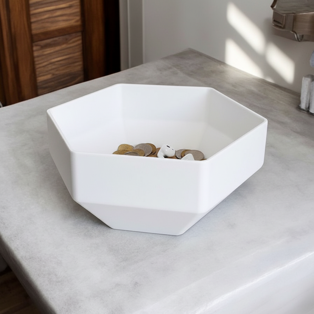 Matte white Minimalist Hexagonal Bowl with coins and earbuds on a Japandi home office desk
