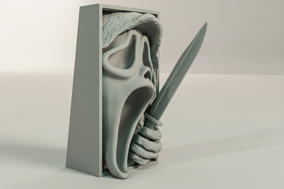 Scream book nook relief sculpture grey framed box side profile close up full three dimensional depth rectangular box frame flowing hooded robe knife blade extending beyond frame edge neutral studio raking side light landscape editorial