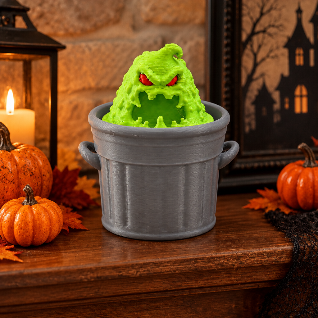 Trash Slime Monster Clicker on Halloween mantel