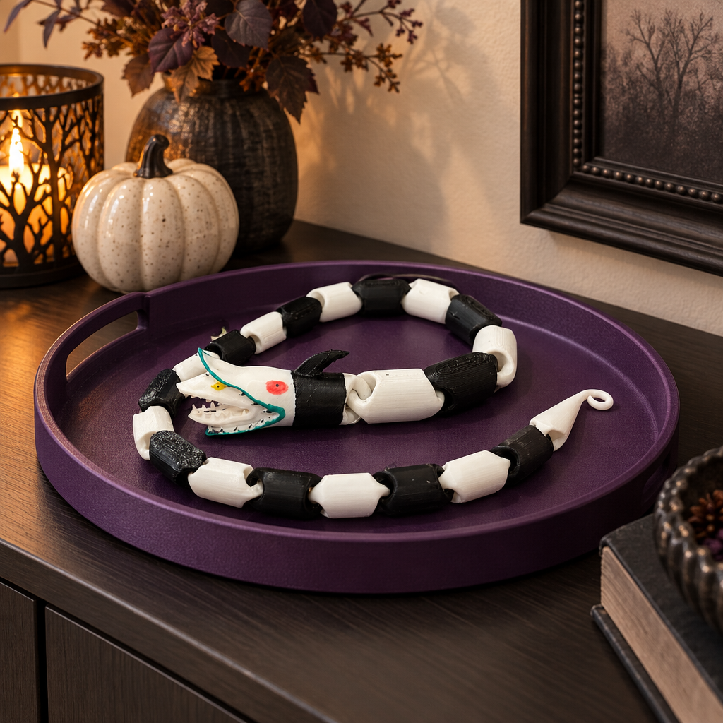 Black and white snake fidget on a purple tray in a stylish interior