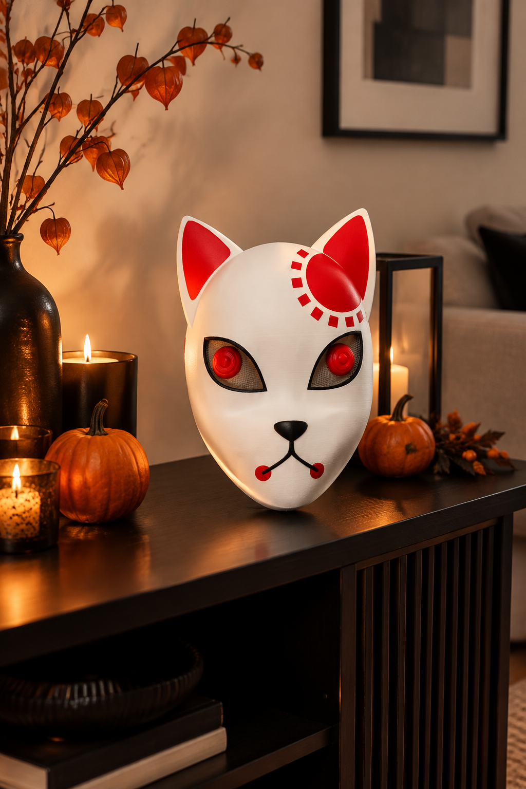 White Halloween devil cat mask displayed on a black console table with subtle Halloween décor