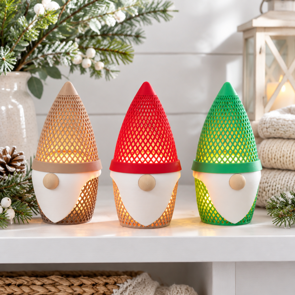 Beige, red and green gonk tealight holders displayed on a bright shelf with winter greenery