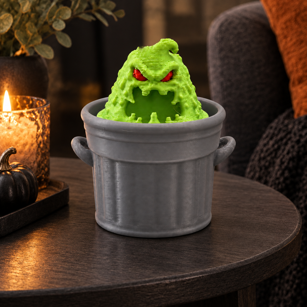 Trash Slime Monster Clicker on charcoal side table