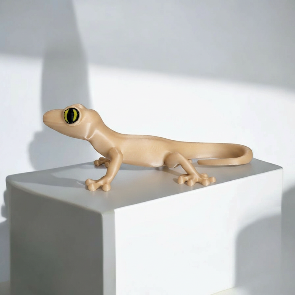 Tiny Desert Gecko Figurine - beige colourway on marble shelf in modern living room