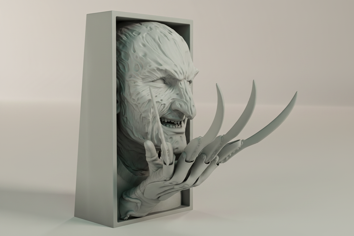 Freddy Krueger book nook relief sculpture grey framed box side profile close up full three dimensional depth rectangular box frame scarred face emerging razor claw blades extending dramatically beyond frame neutral studio raking side light landscape editorial