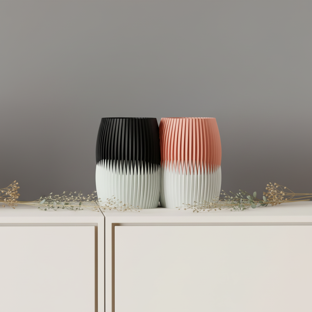 Black-top and blush-top fluted vases, both with white bottom sections
