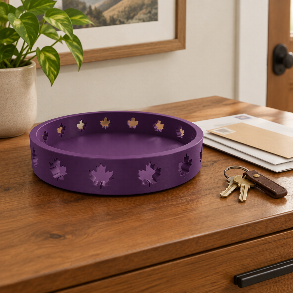 Solid purple round Autumn Tray with maple-leaf cutouts on a warm wood console
