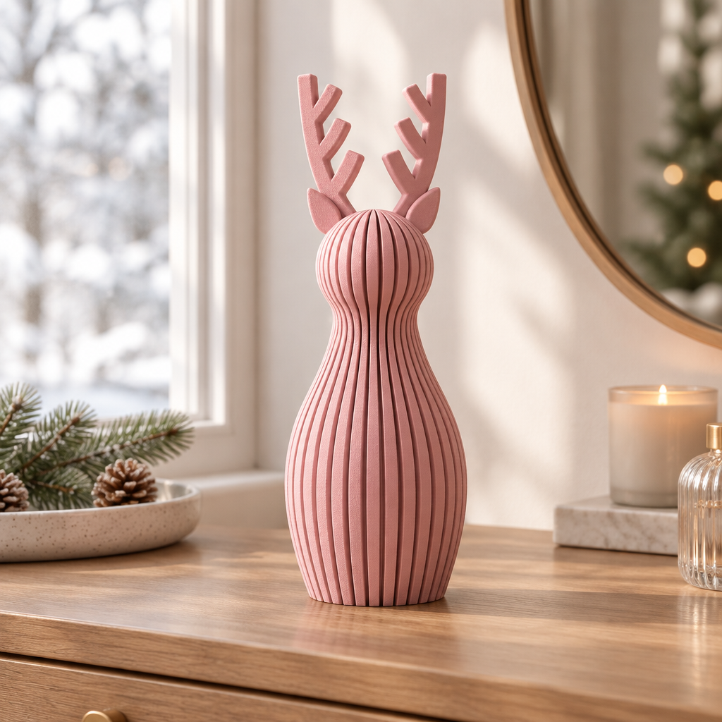 A single pink ribbed Christmas reindeer ornament on a tidy dressing table in soft daylight