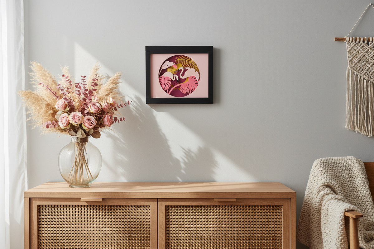 Flamingo Paradise Shadow Box hung above a bedroom dresser with pampas grass and pink flowers