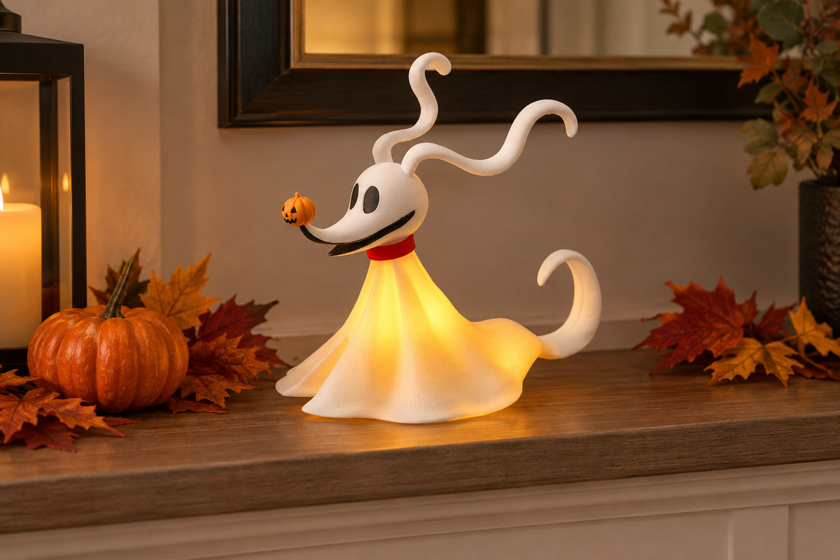 White ghost dog tealight holder with a gentle LED glow on a Halloween mantel