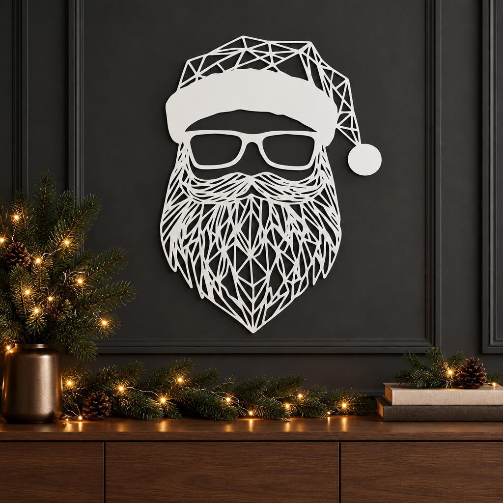 White geometric Santa sign displayed against a charcoal wall with subtle festive greenery
