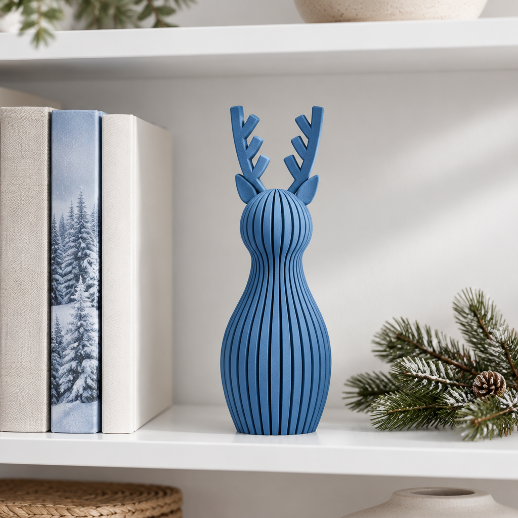 A single blue ribbed reindeer ornament styled on a white bookshelf in a bright contemporary home
