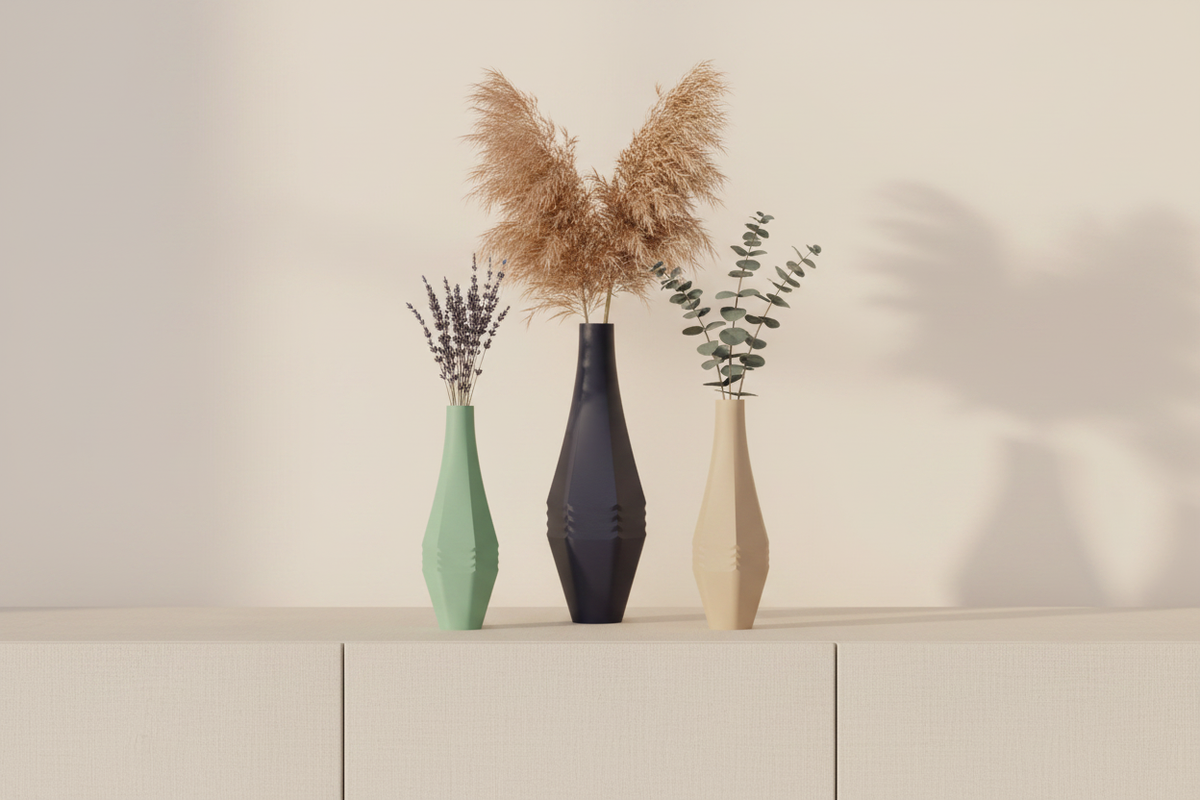 Three Stagger Panel Vases sage green warm beige deep navy blue matte diamond-waisted staggered faceted panels dried pampas lavender eucalyptus pale linen sideboard warm cream wall bright contemporary living room soft evening light wide editorial landscape