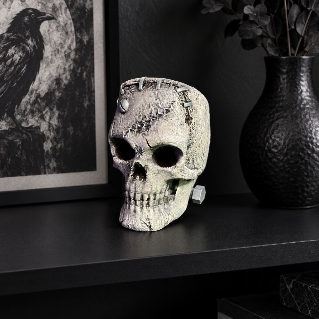 Textured skull with bolt displayed directly on a matte black shelf