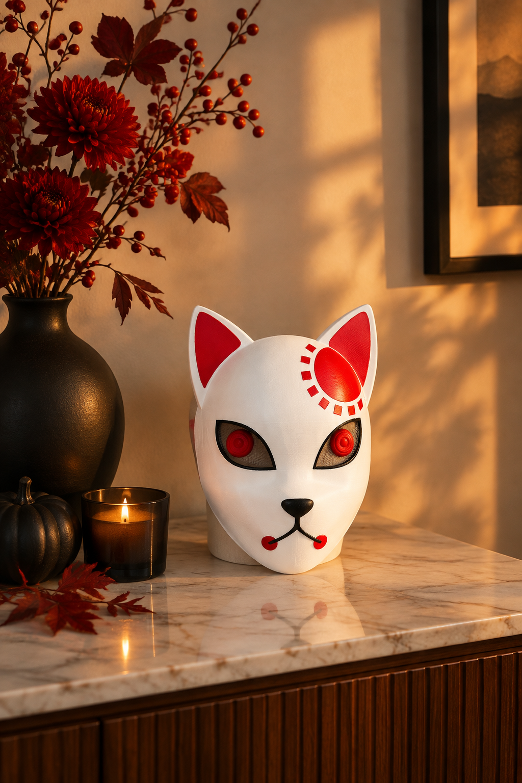 White Halloween devil cat mask on a marble sideboard with red flowers and a black vase