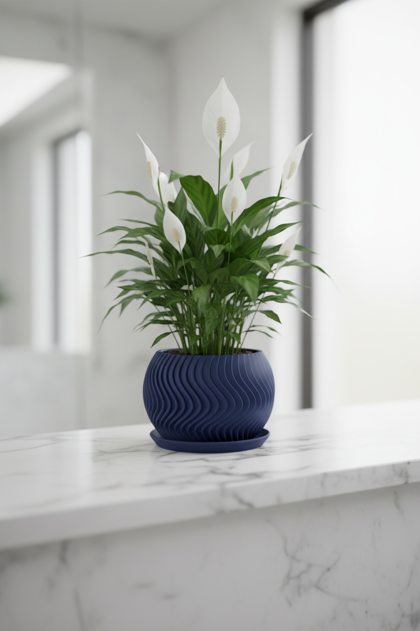 Modern Wavy Planter Pot deep navy blue flowing vertical wave texture matching drainage tray compact peace lily white marble bathroom shelf bright contemporary bathroom natural light portrait
