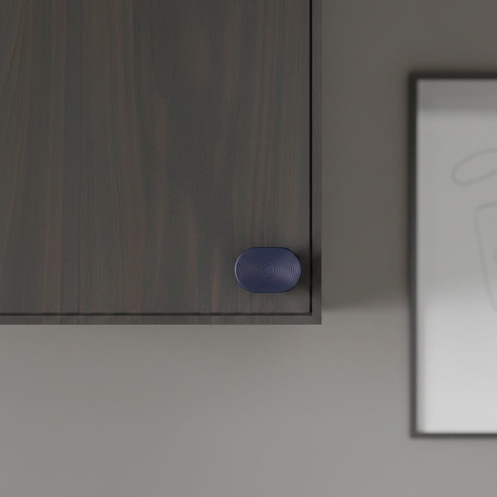Concentric Circle Cabinet Handle Face on dark kitchen cabinet