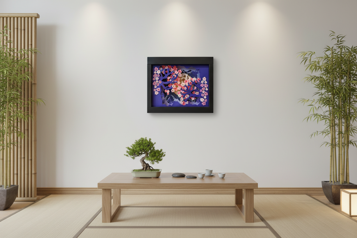 Sakura shadow box on a white wall in a Japanese-inspired living room with bamboo accents and bonsai plant