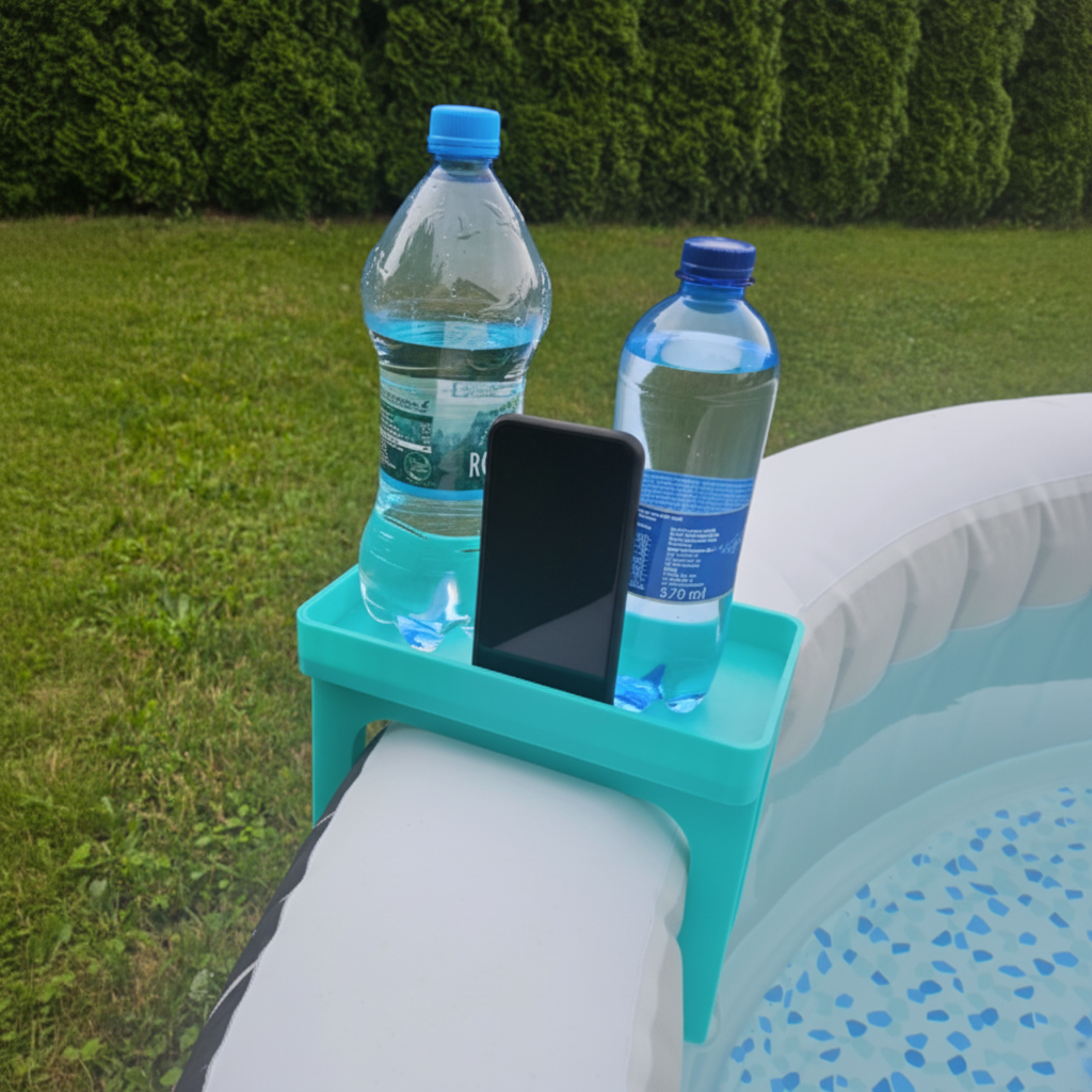 Green hot tub caddy clipped onto inflatable hot tub holding two drinks bottles and a phone in sunny garden