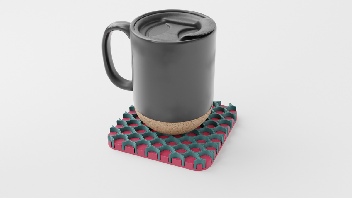 Black mug resting on a pink and green Triple Interlocking Coaster Set