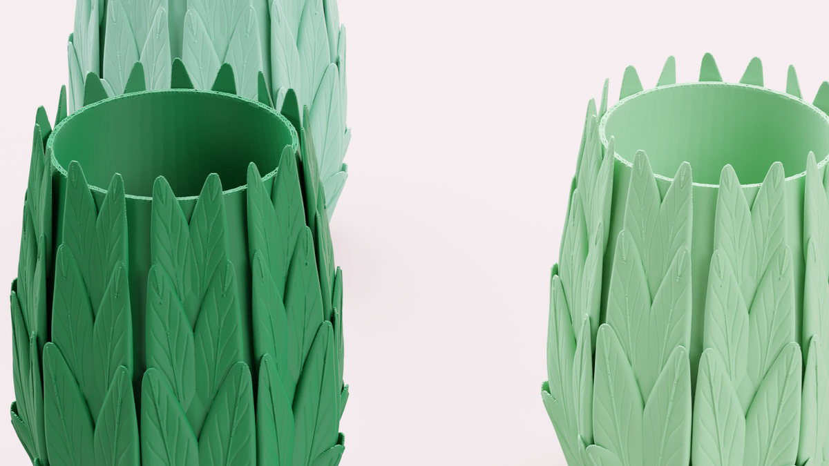 Close-up detail of the overlapping leaf texture on a green desk organiser