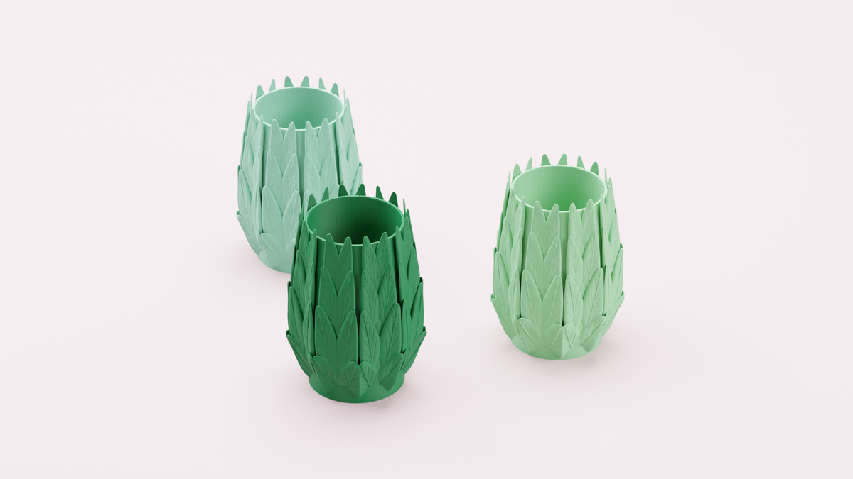 Three Layered Leaf Desk Organisers arranged in a row in different green shades