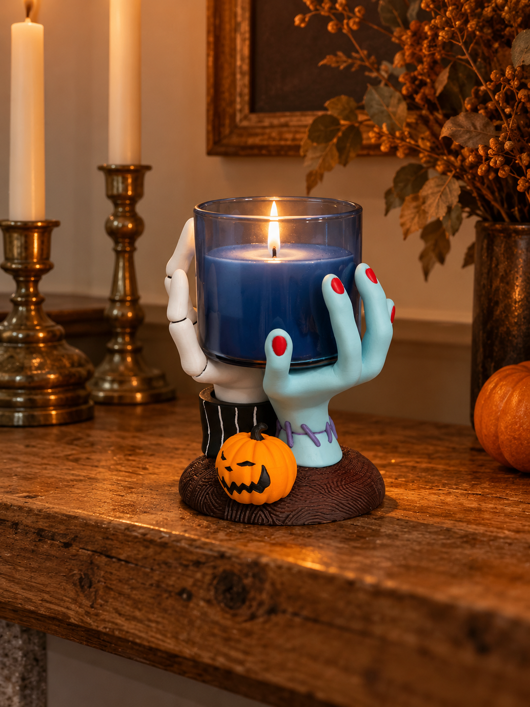 Hands Candle Holder with sculpted hands and pumpkin accent displayed in a bright autumn interior