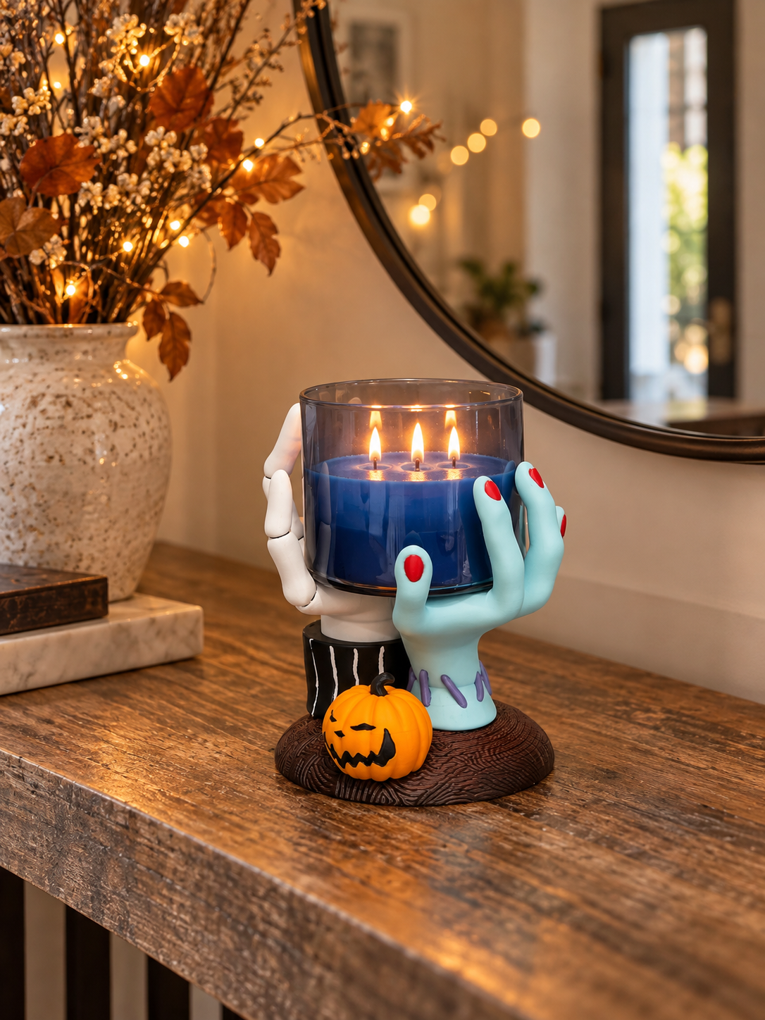 Hands Candle Holder with candlelight styled on a dark Halloween dining table