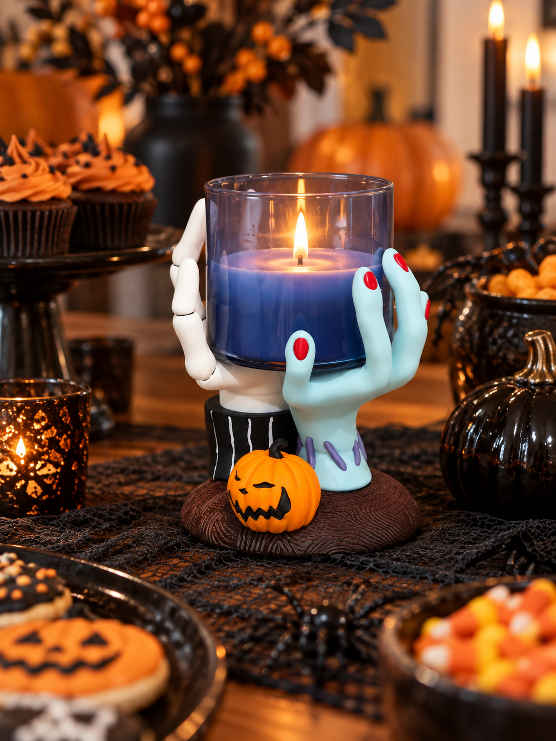 Hands Candle Holder with a lit candle displayed outdoors in an autumn evening setting