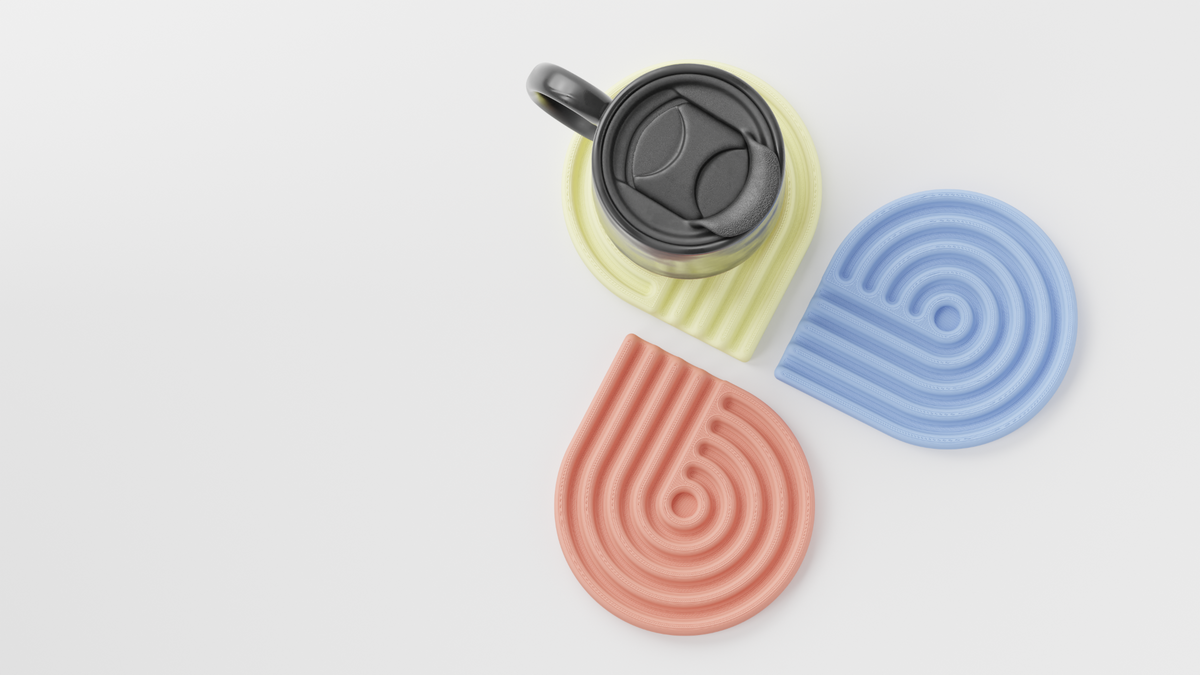 Black travel mug on pastel looped coasters
