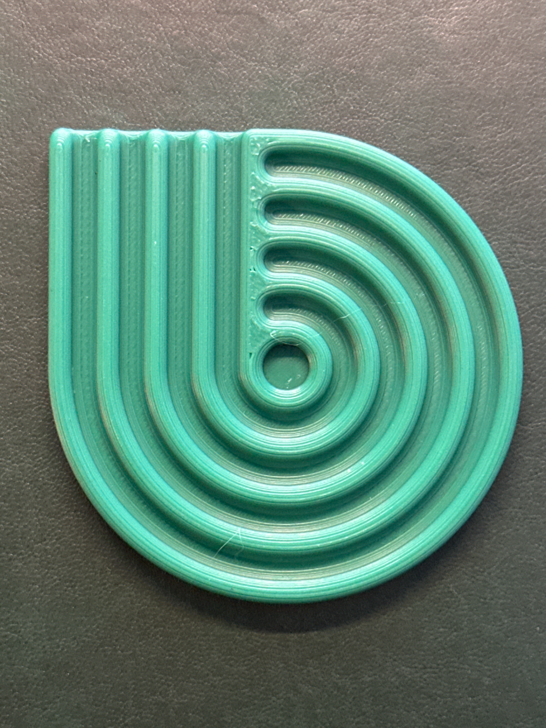 Overhead view of pastel looped coasters with a mug