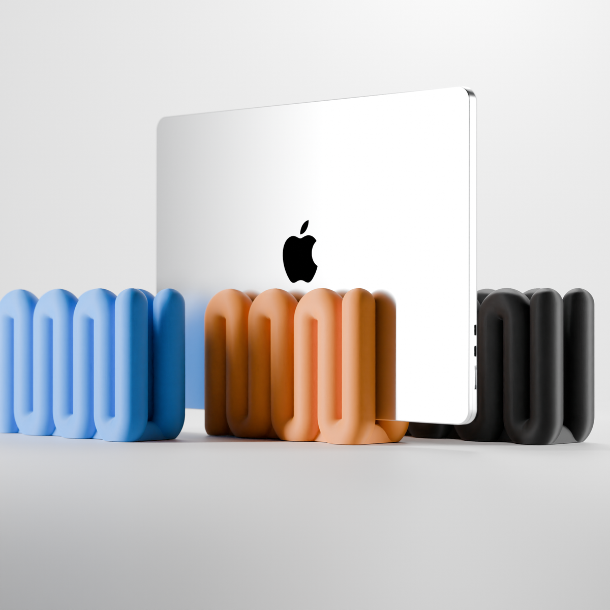 Wibble Vertical Laptop Stand - main lifestyle render orange with MacBook