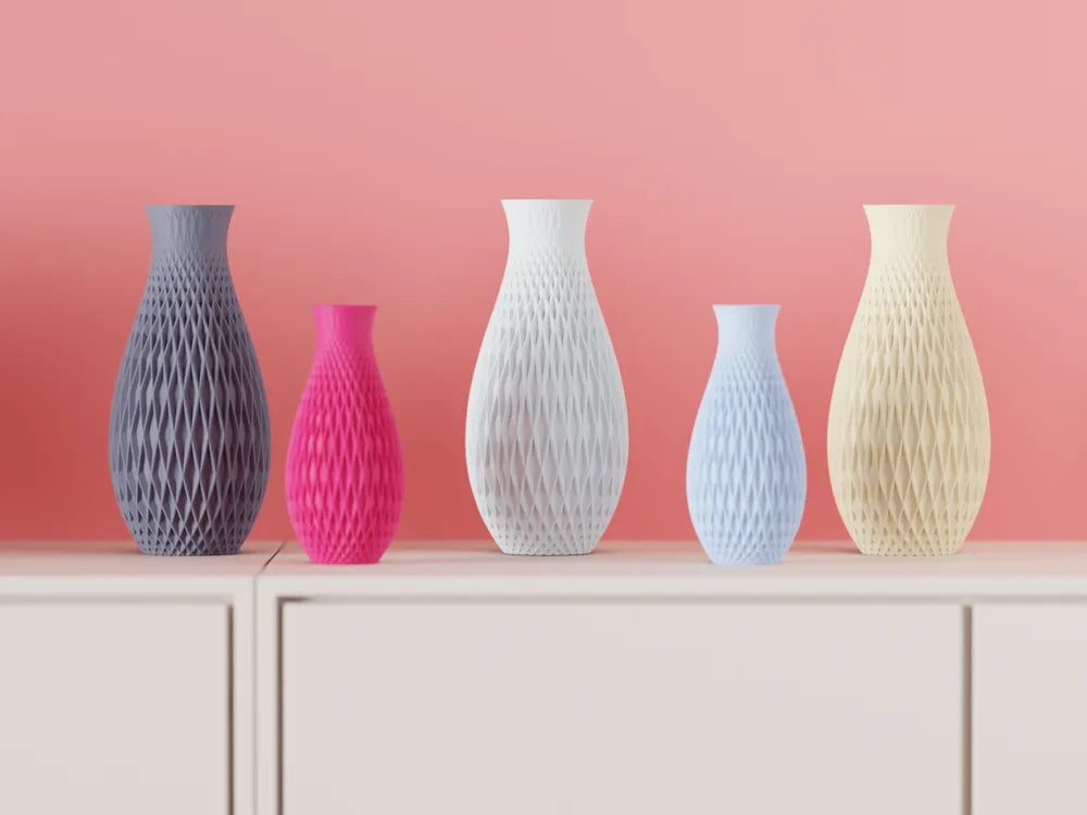 Textured Geometric Vase five vases diamond-weave lattice pattern grey magenta white powder blue cream on pale sideboard coral pink wall wide shot