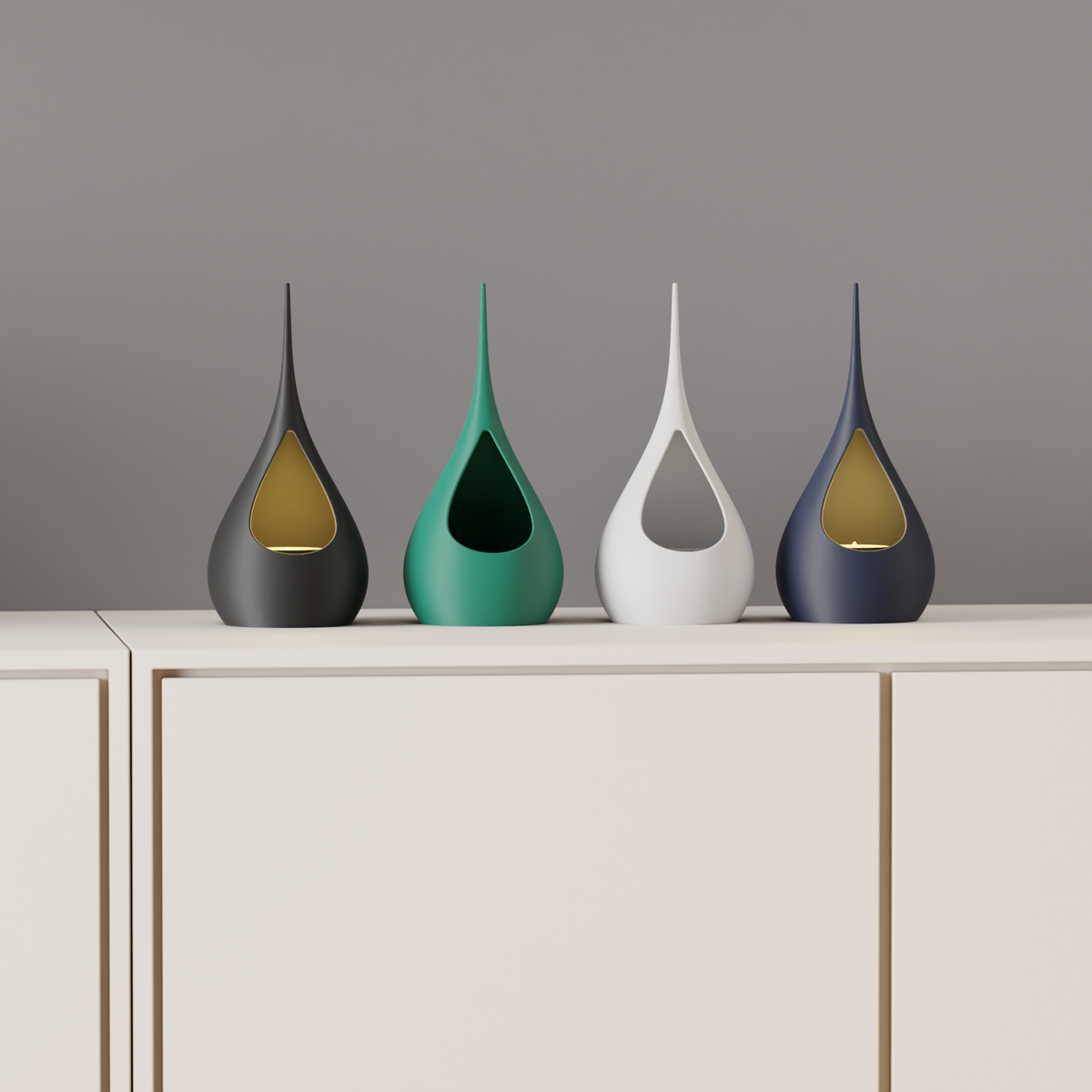 Teardrop LED Tealight Holder four holders black forest green white navy teardrop aperture warm gold LED glow cream sideboard grey wall wide shot