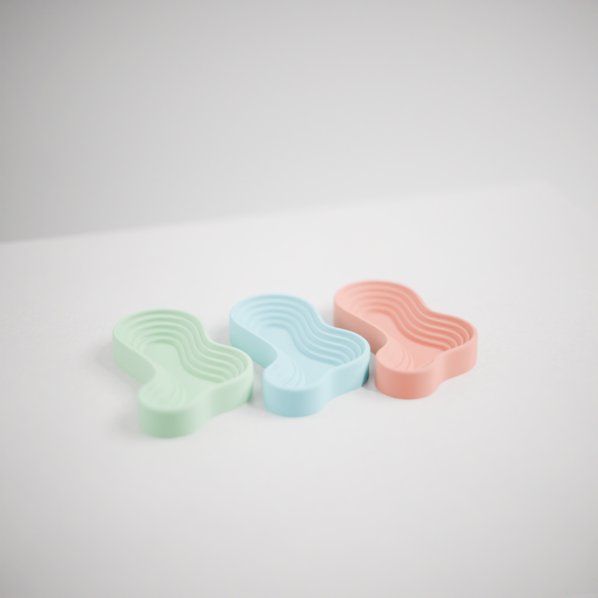 Ripple Tray Organizer Set main product render three trays sage green powder blue soft peach clean white background top view