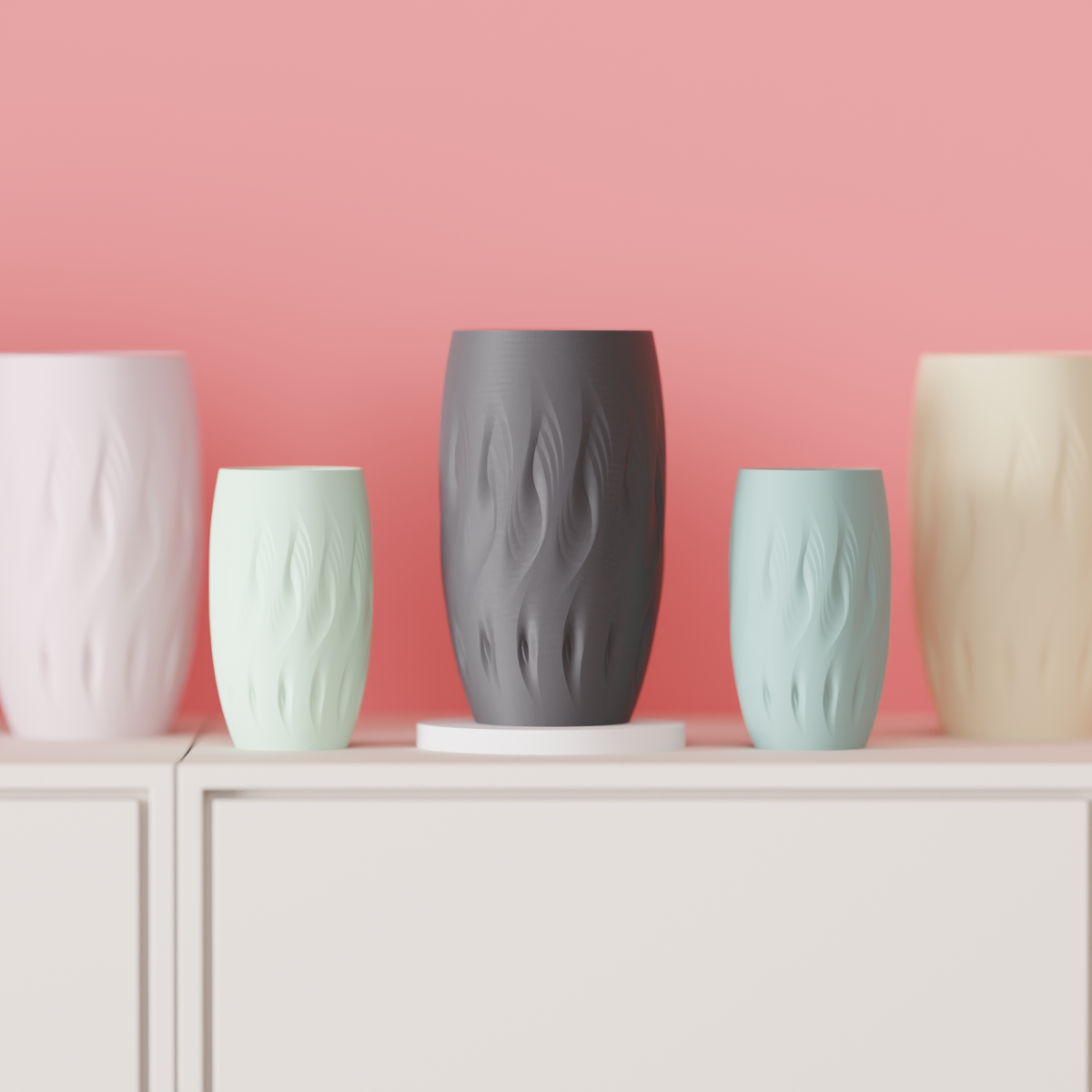 Stagger Twist Vase broad barrel form flowing organic flame-twist surface impressions contours dark charcoal grey matte finish floating mid air surrounded by pale green and sage geometric shapes teal green gradient background dramatic editorial portrait