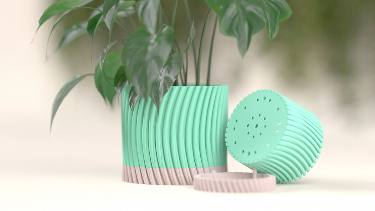 Modern Twist Self-Watering Planter product studio shot teal body pink base with dripper