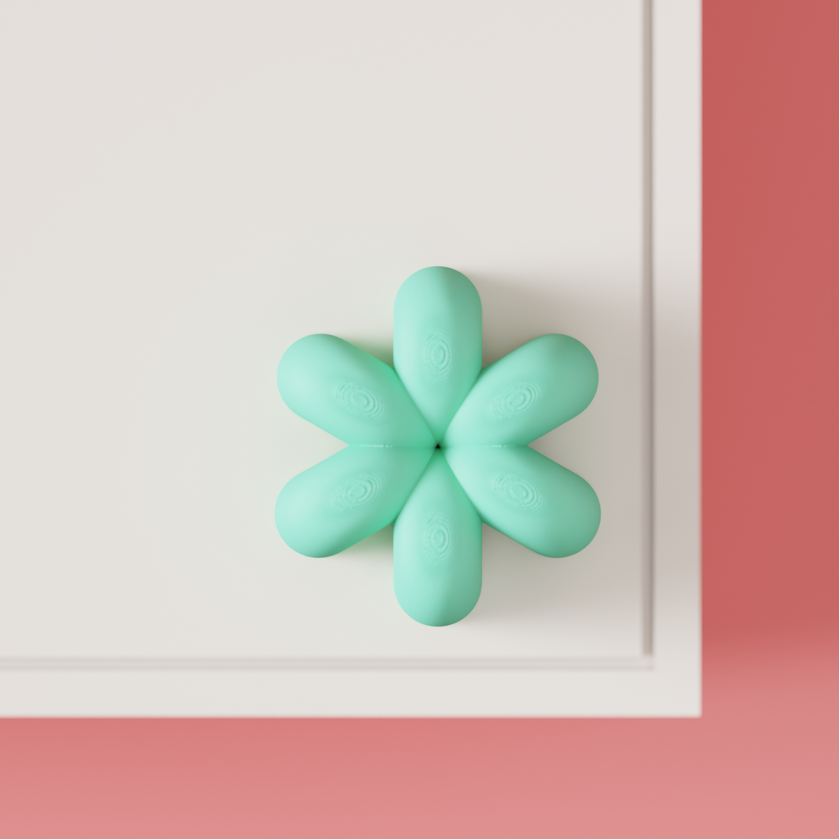 Wibble Cabinet Handle — mint green on white Shaker cabinet door close-up