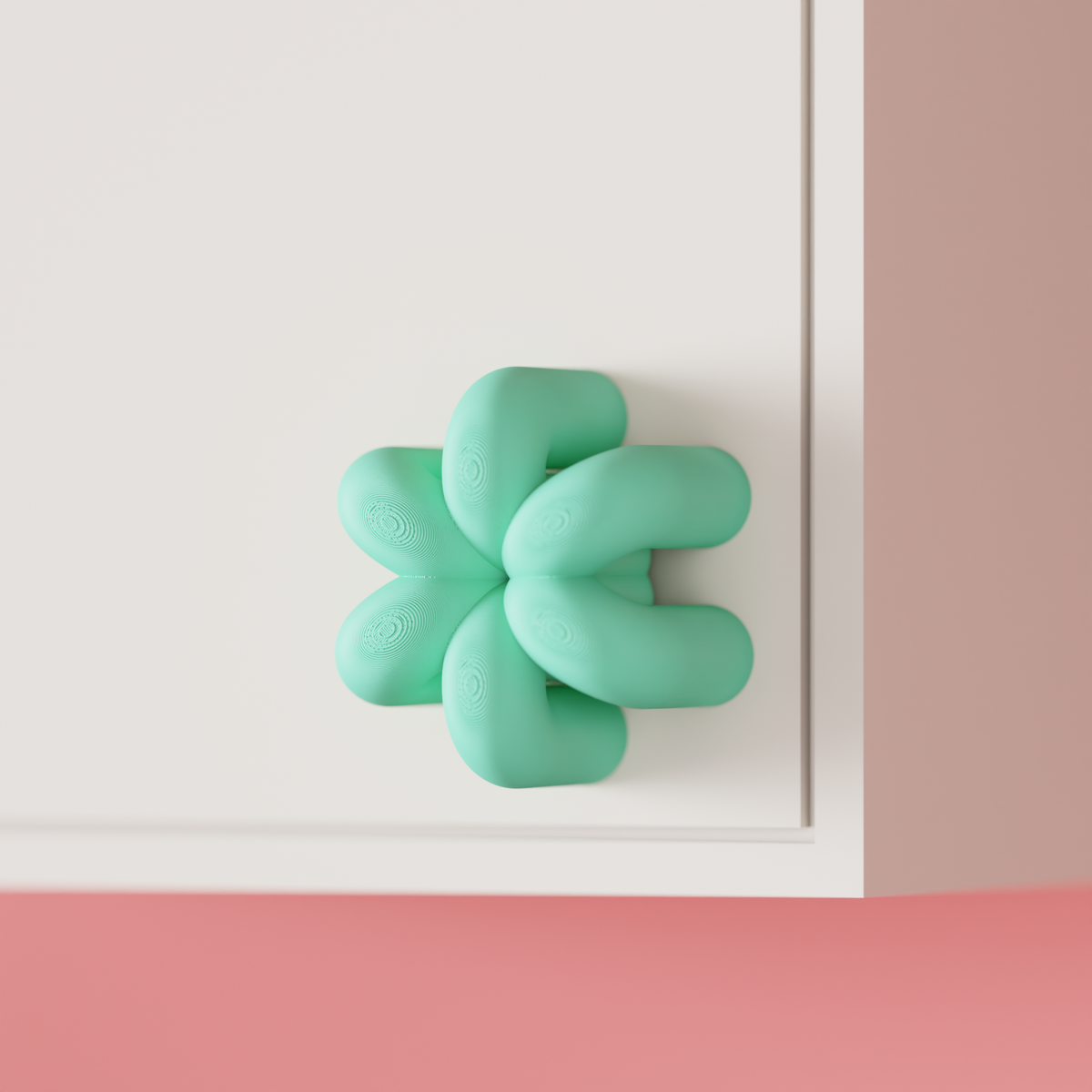 Wibble Cabinet Handle — mint green on white cabinet corner lifestyle shot