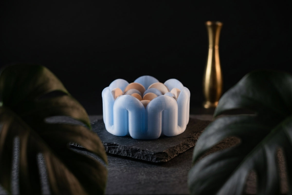 Wibble nested trays render front view showing graduated sizing and scallop bubble edge