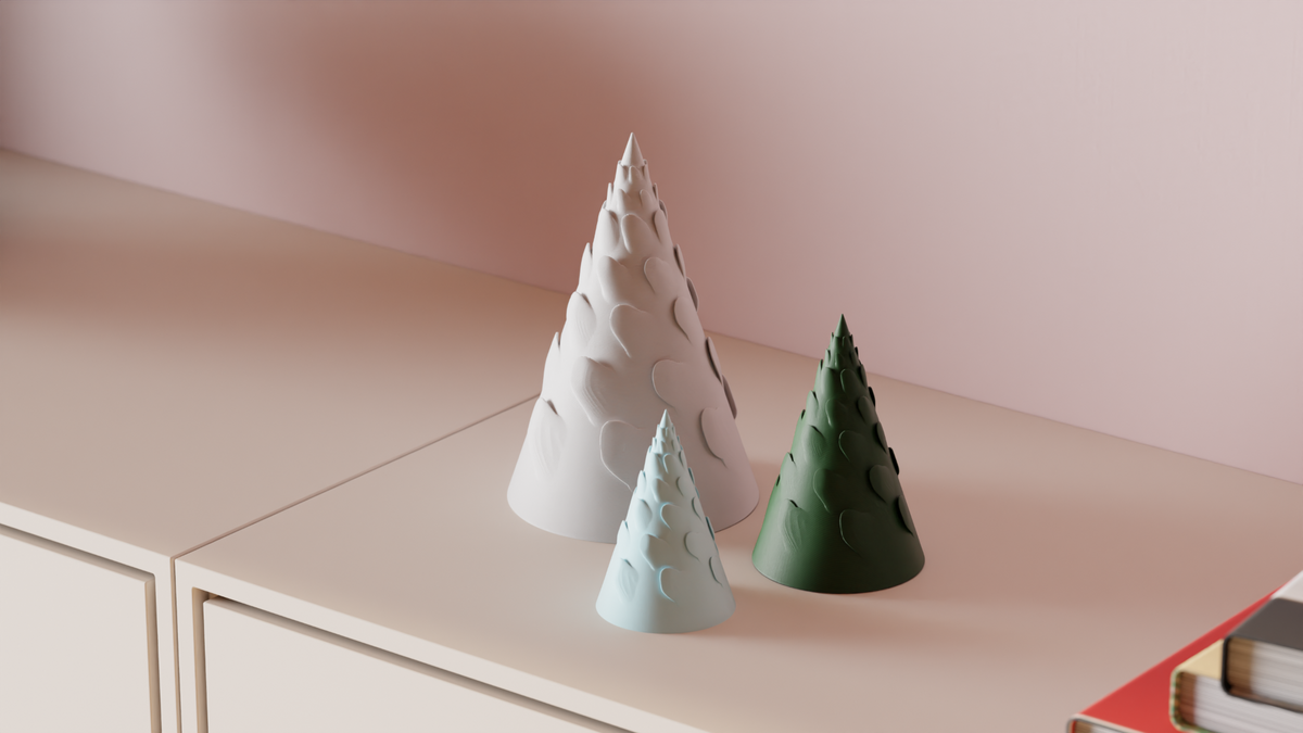 Three Spiral Branch Christmas Trees arranged on a modern sideboard
