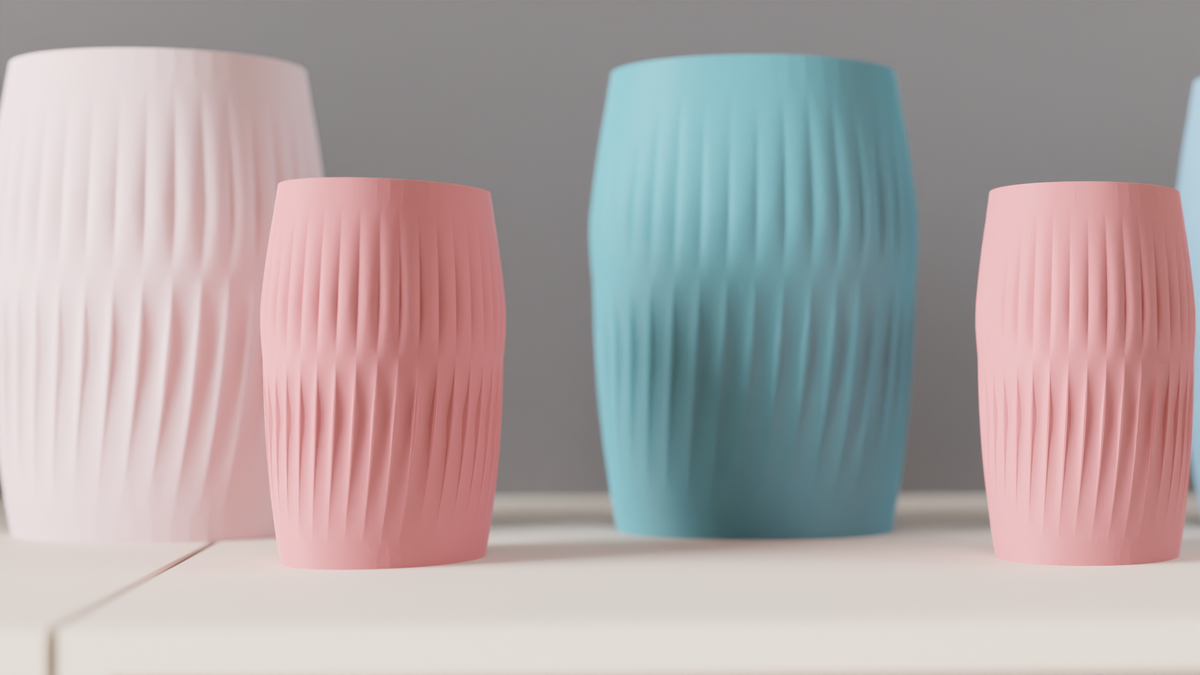 Large and small Ripplied Barrel Vases arranged together on a white sideboard