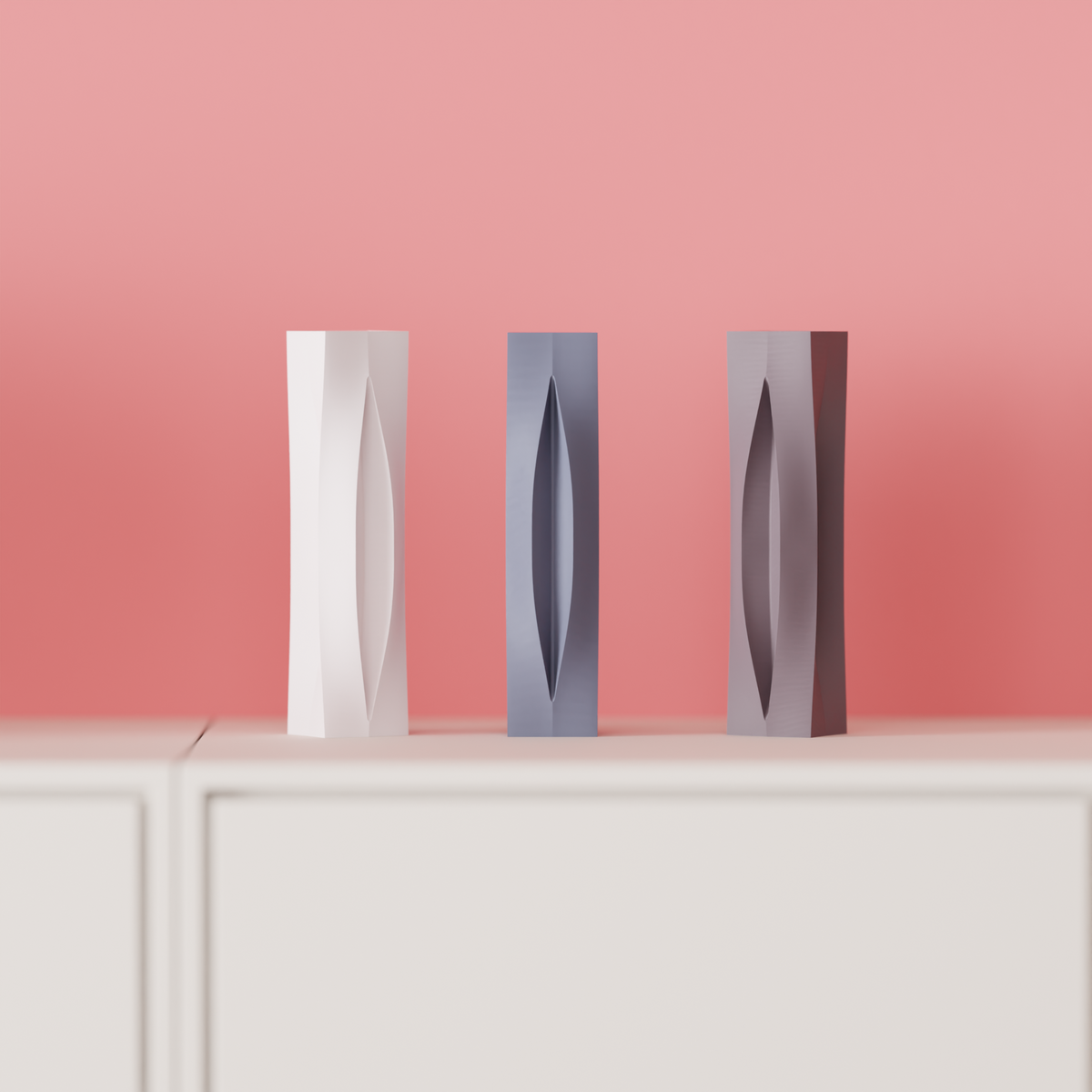Sleek Modern Aperture Vase white grey brown trio on white surface close up editorial