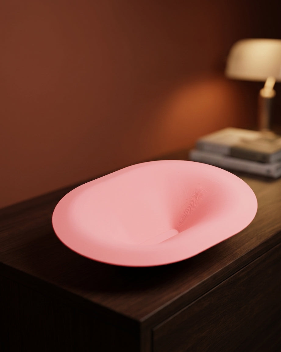 Soft Pill Catch All Bowl pink held in two hands front view showing interior