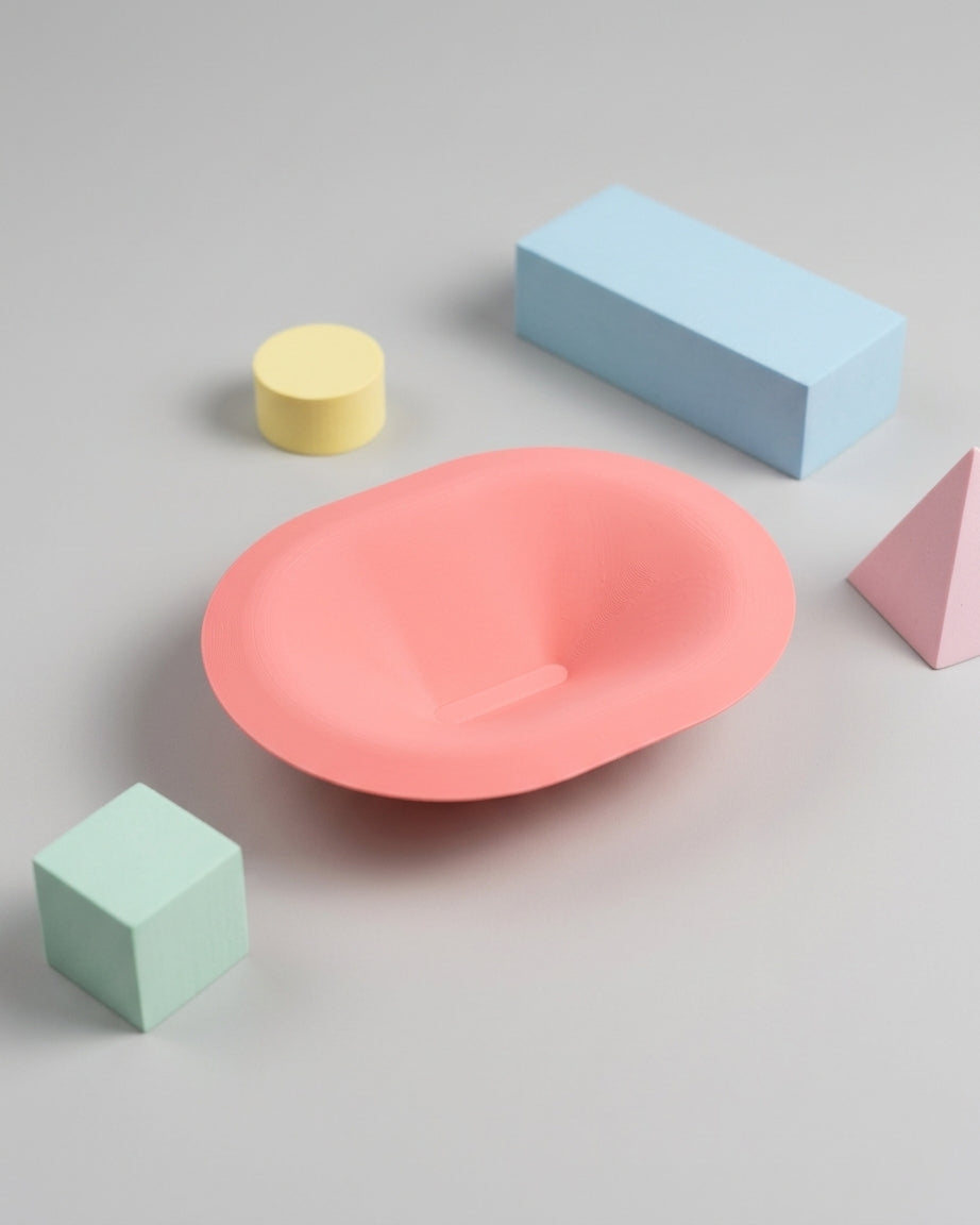 Soft Pill Catch All Bowl pink on dark wood nightstand with warm lamp light